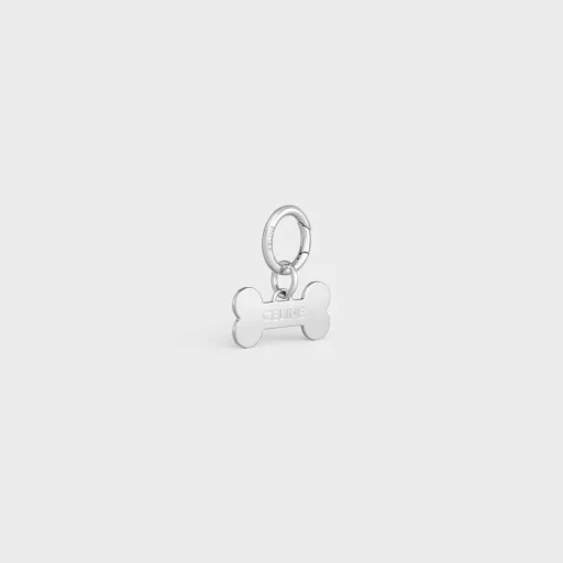 Bone dog medal in brass