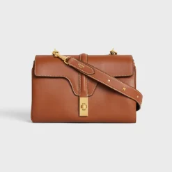 LONG STRAP in smooth CALFSKIN WITH TRIOMPHE STUDS with Gold Finishing