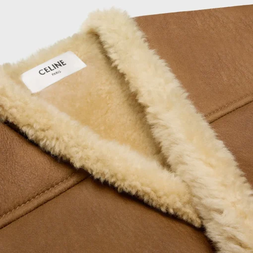 oversized sleeveless jacket in curly lambskin