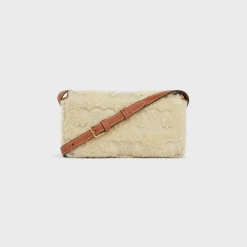 SHOULDER BAG CLAUDE in SHEARLING WITH TRIOMPHE EMBROIDERIES
