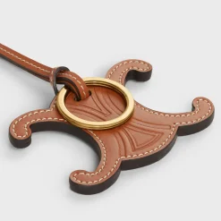 TRIOMPHE KEYRING CHARM in SMOOTH CALFSKIN with GOLD FINISHING