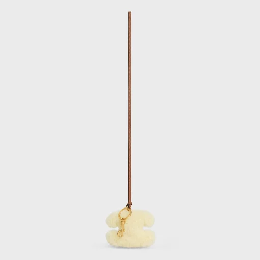 TRIOMPHE pom-pom keyring in SHEARLING AND SMOOTH CALFSKIN with Gold Finishing