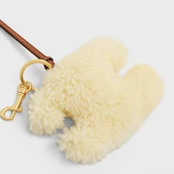 TRIOMPHE pom-pom keyring in SHEARLING AND SMOOTH CALFSKIN with Gold Finishing