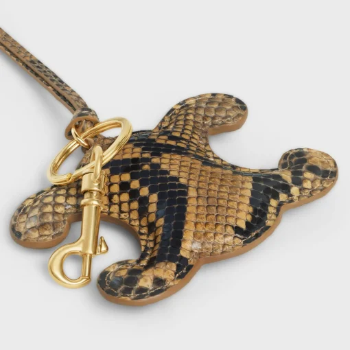 TRIOMPHE pom-pom keyring in PYTHON with Gold Finishing