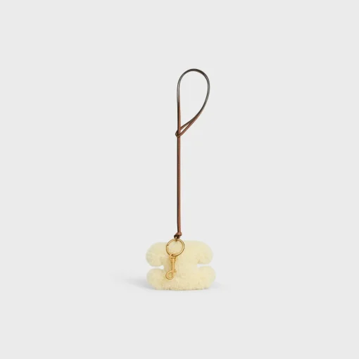 TRIOMPHE pom-pom keyring in SHEARLING AND SMOOTH CALFSKIN with Gold Finishing